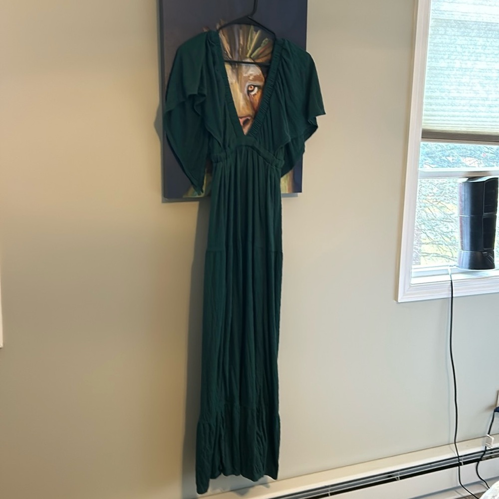 Gorgeous green free people dress, runs big. I’m usually a medium